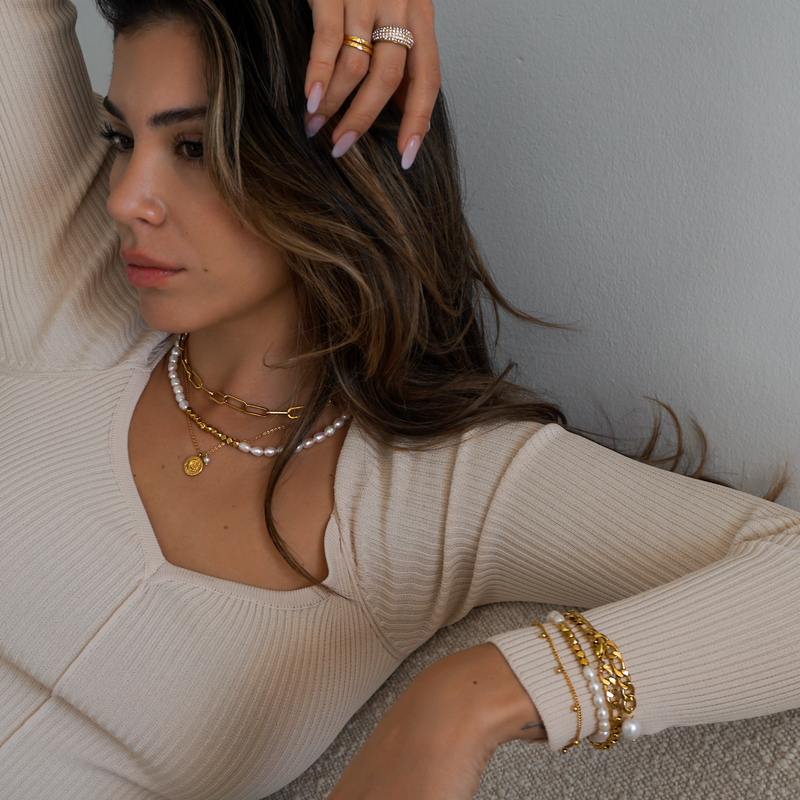 A beautiful set of genuine pearls and geometric gold beads bring the perfect finishing touch to any outfit.
